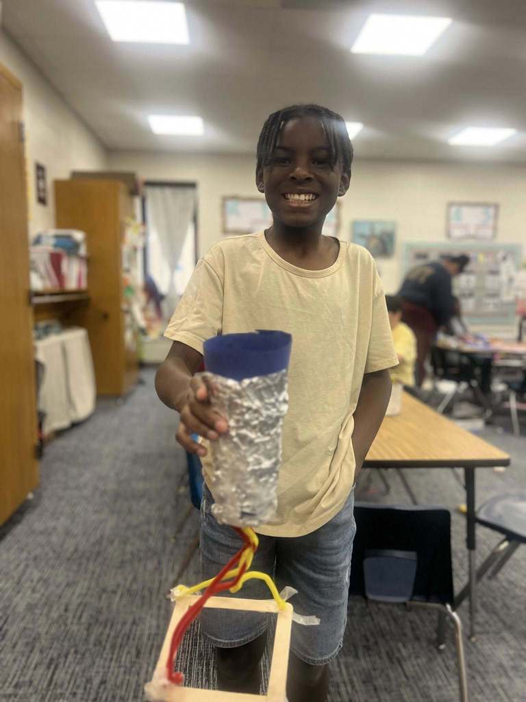 student showing their finished project