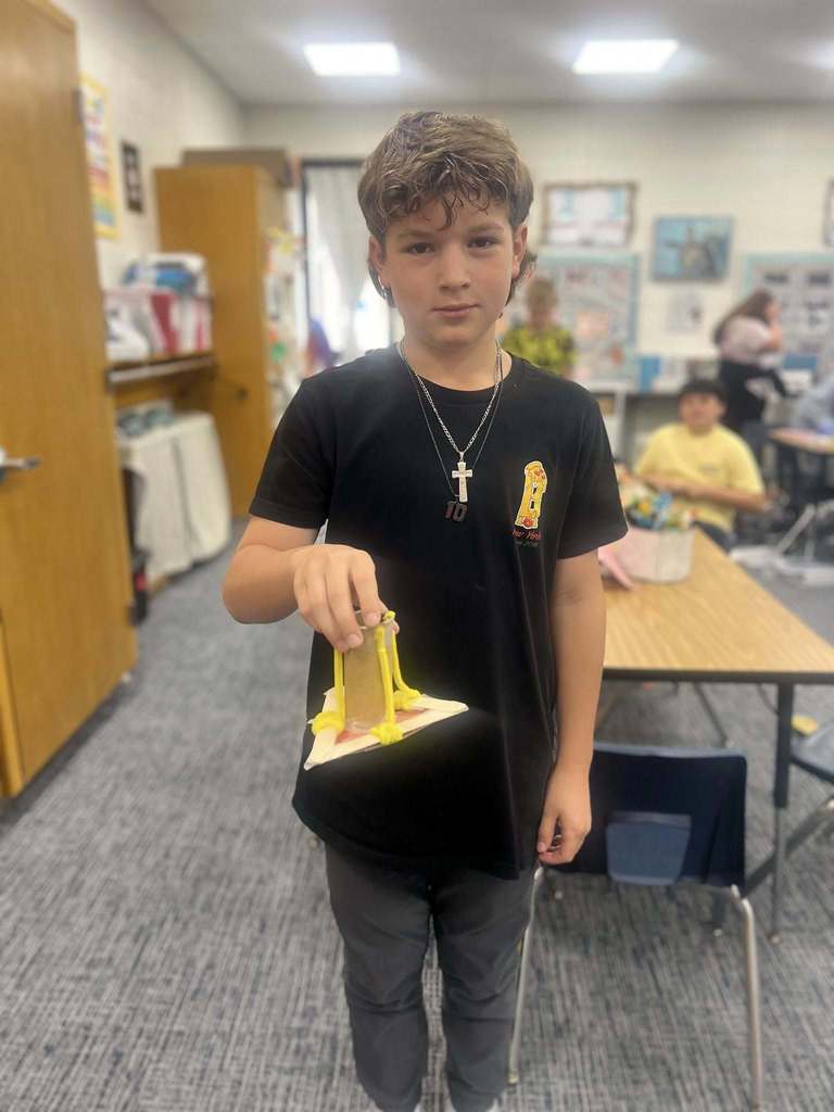 student showing their finished project