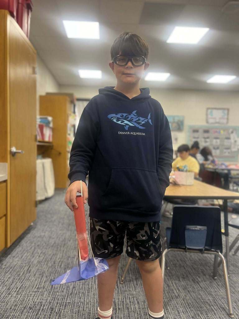 student showing their finished project