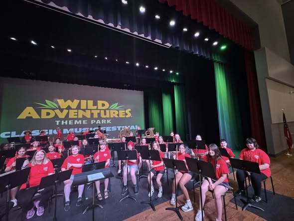 SMMS band sitting ready to play