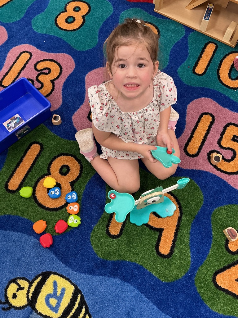 While it looks like simple fun, building with blocks and playing pretend help our students master math, build vocabulary, and learn to cooperate with friends.