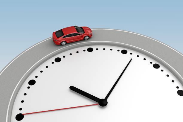 A car driving on the outside edge of a large clock.