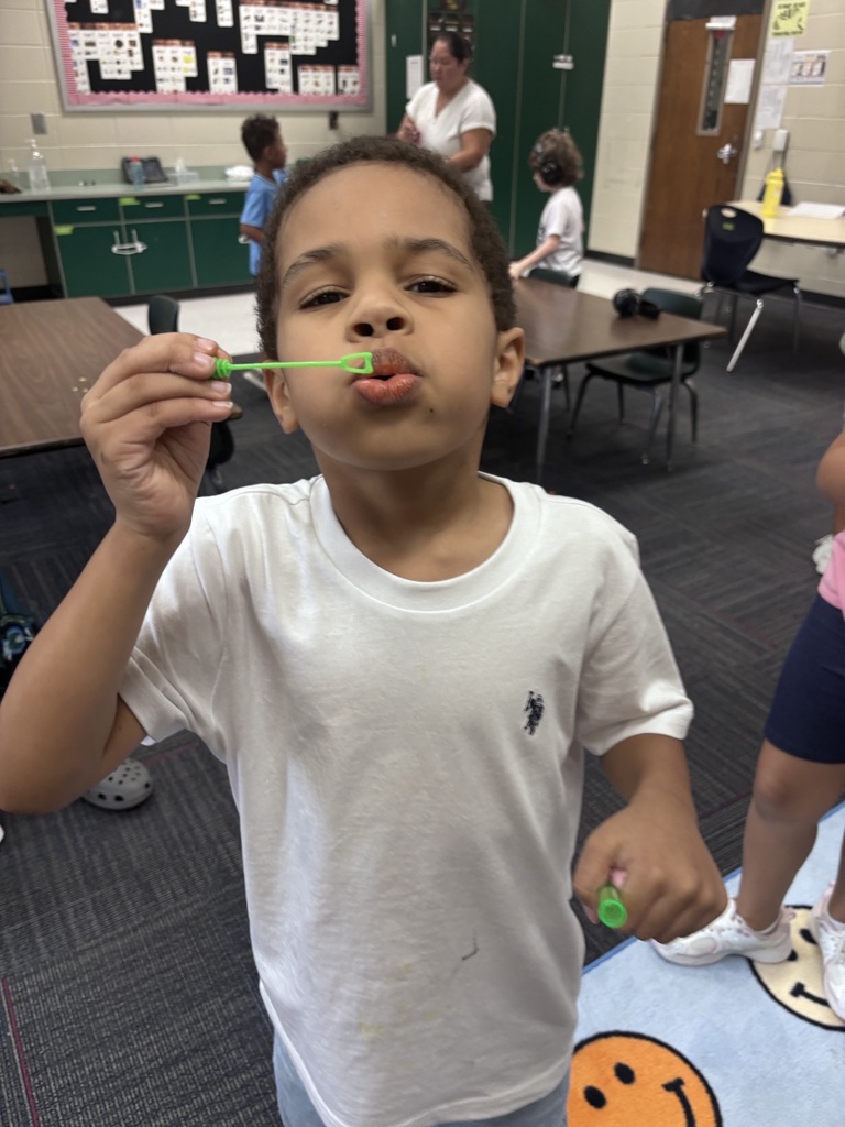 students in Mrs. Agee's room practice blowing bubbles