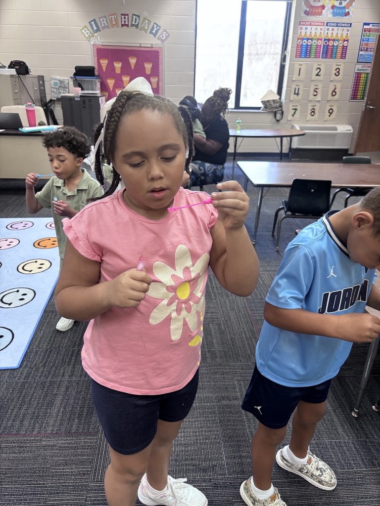 students in Mrs. Agee's room practice blowing bubbles