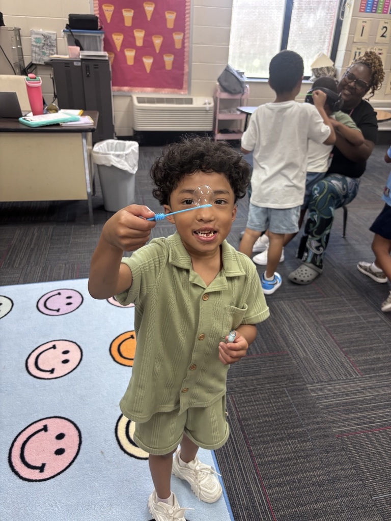 students in Mrs. Agee's room practice blowing bubbles
