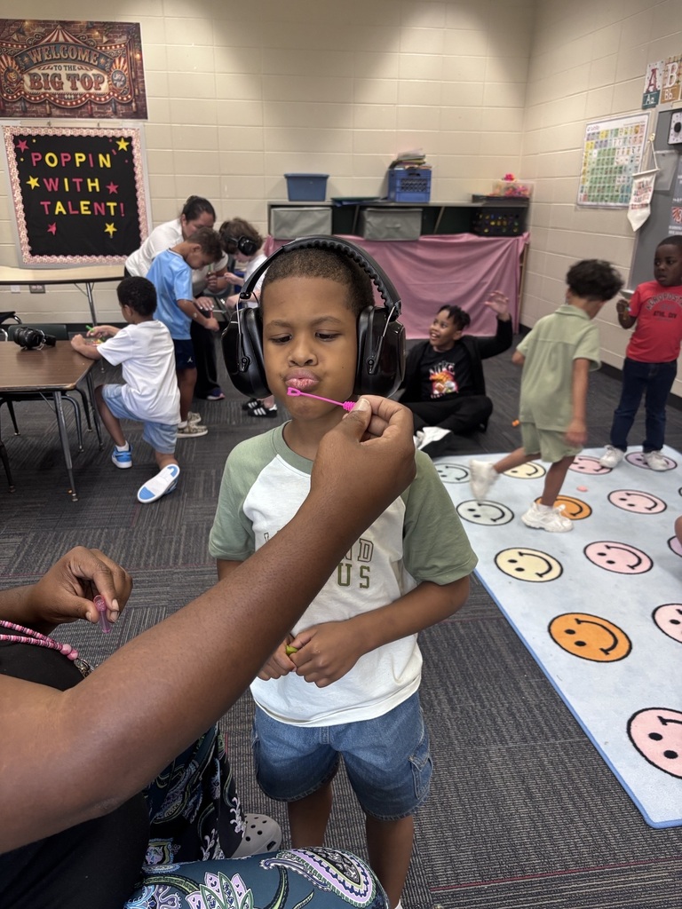 students in Mrs. Agee's room practice blowing bubbles