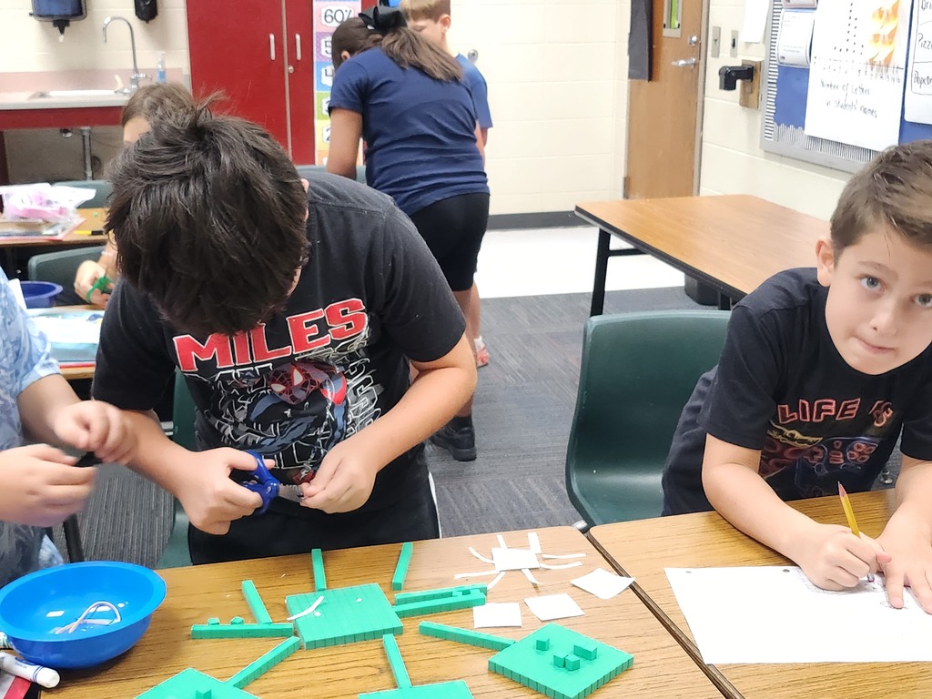 3rd graders make base ten robots