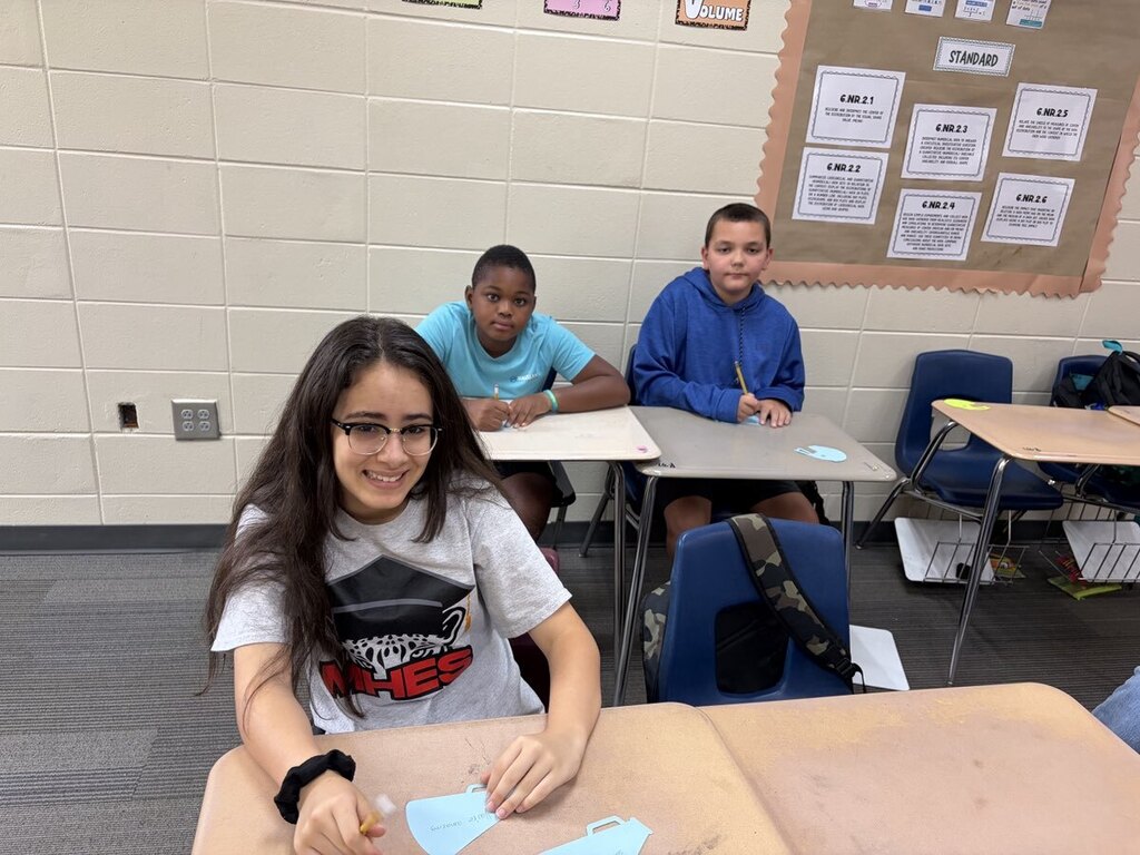 Students making encouraging notes for teachers