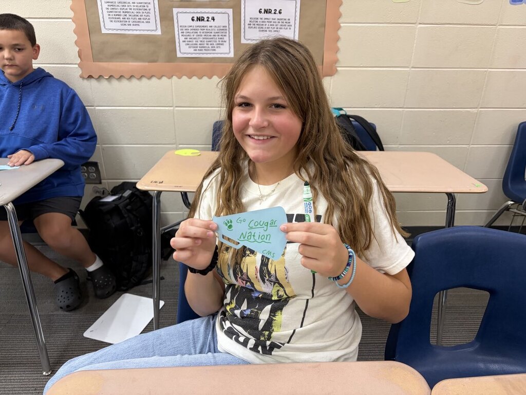 Students making encouraging notes for teachers