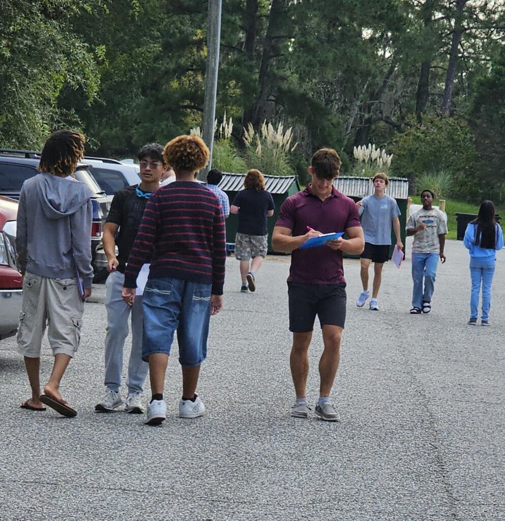 AP Environmental Students studying the biodiversity of cars in the parking lot