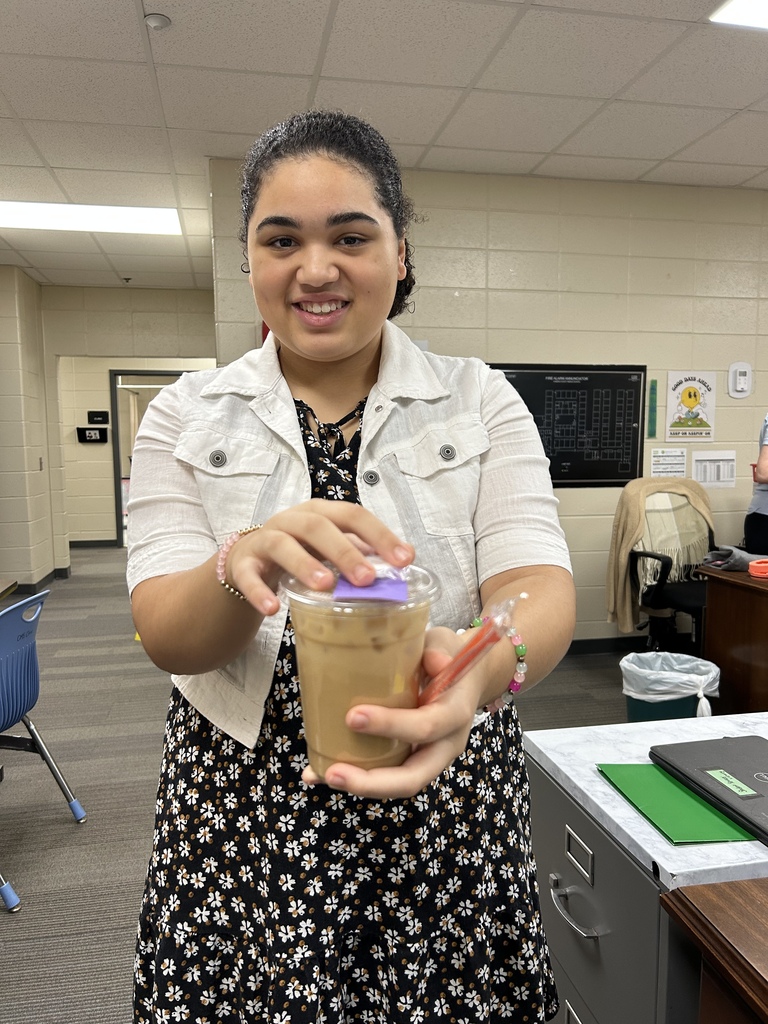 Student serving coffee