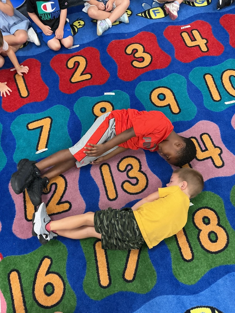 PreK students making shapes with their bodies