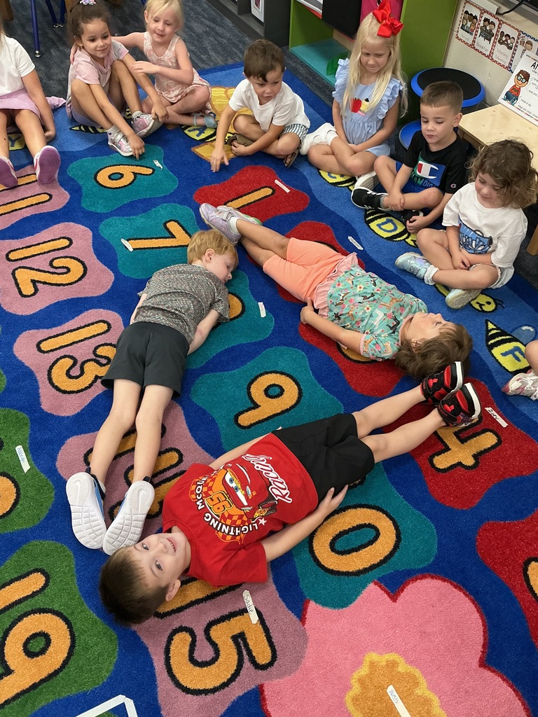 PreK students making shapes with their bodies
