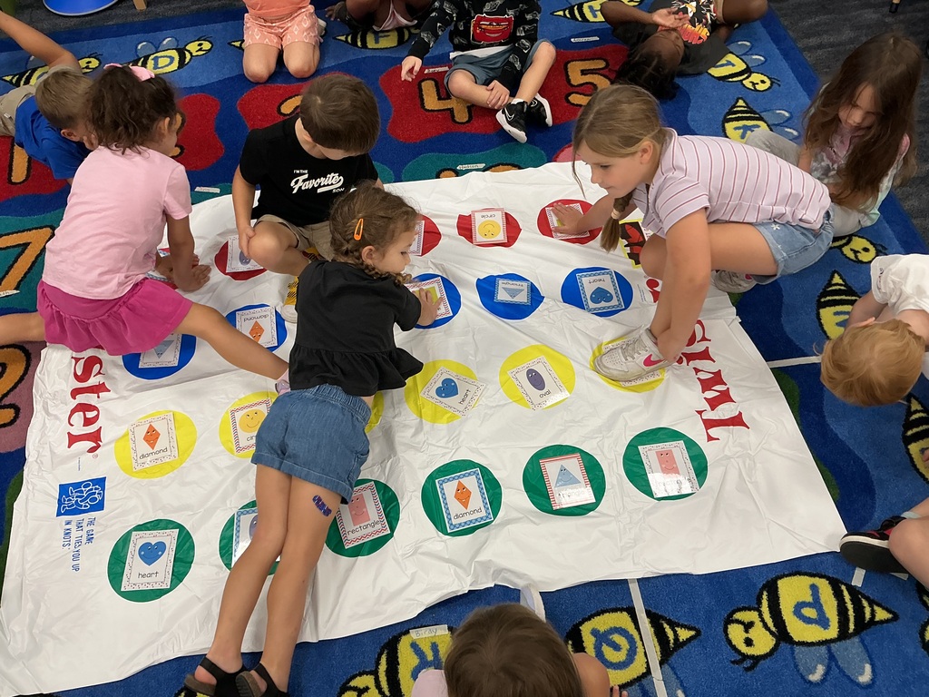 Students playing shape twister