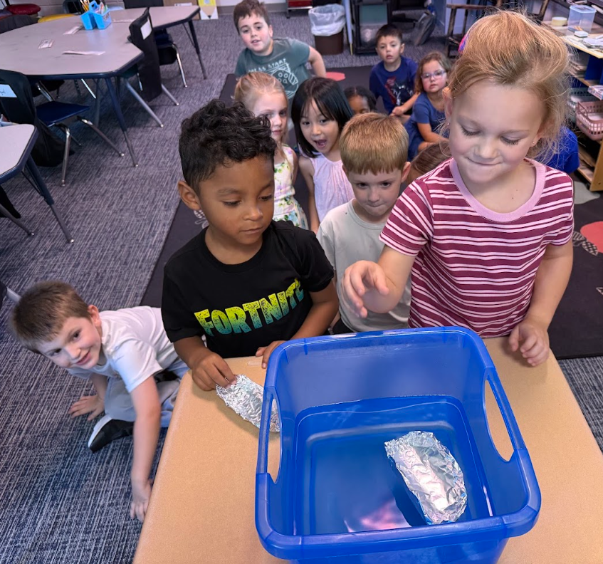 Kindergarteners learning about forces through transportation activities.