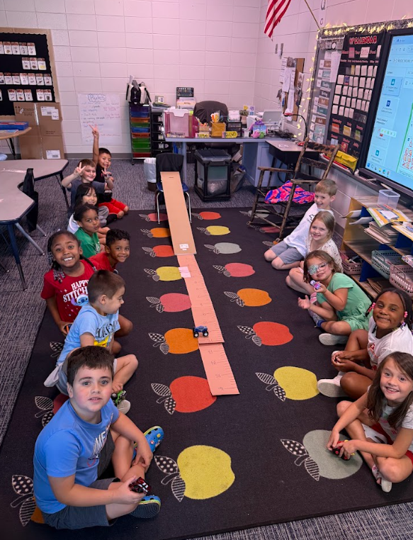 Kindergarteners learning about forces through transportation activities.