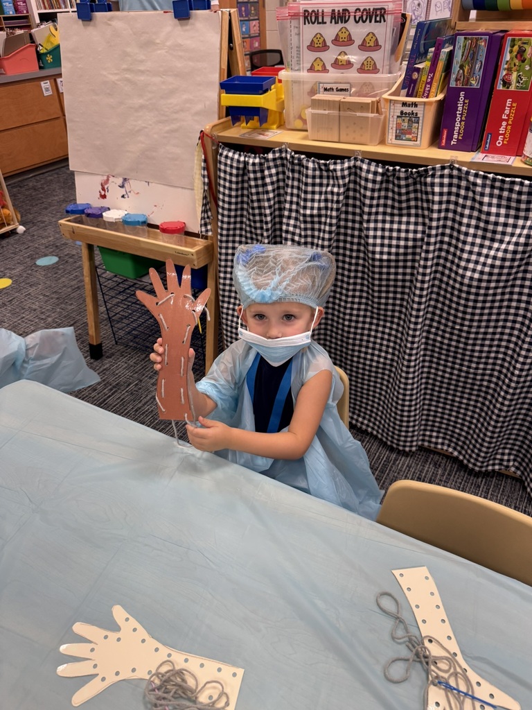 Mrs. Williams' Pre-K class explored community helpers this week through hands-on dress-up and medical play designed to strengthen their fine motor skills.