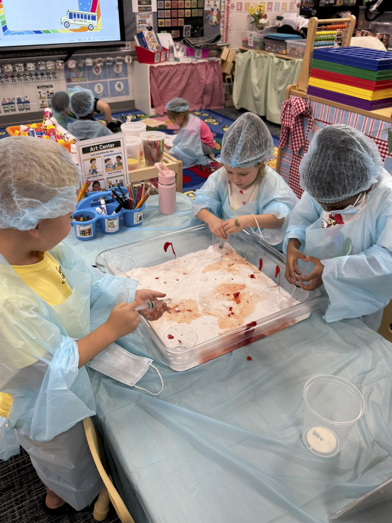 Mrs. Williams' Pre-K class explored community helpers this week through hands-on dress-up and medical play designed to strengthen their fine motor skills.