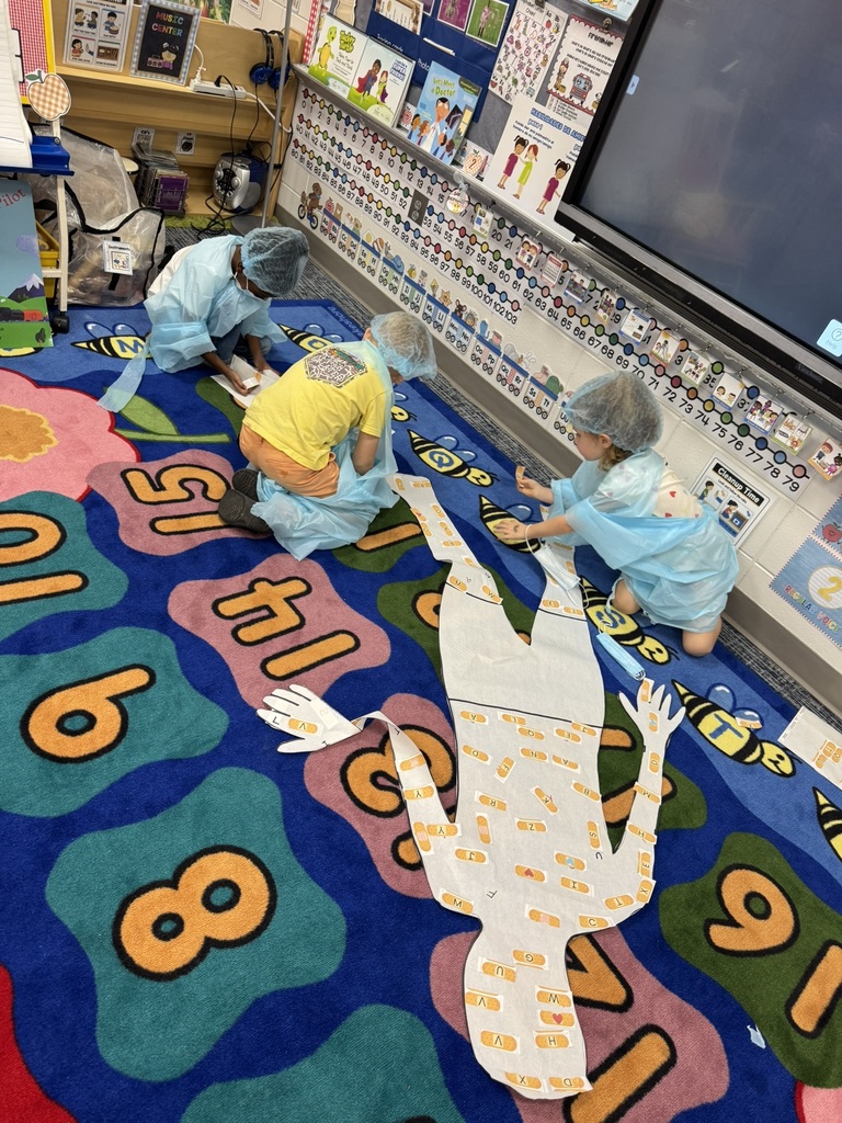 Mrs. Williams' Pre-K class explored community helpers this week through hands-on dress-up and medical play designed to strengthen their fine motor skills.