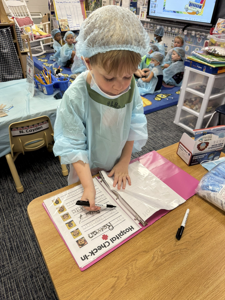 Mrs. Williams' Pre-K class explored community helpers this week through hands-on dress-up and medical play designed to strengthen their fine motor skills.
