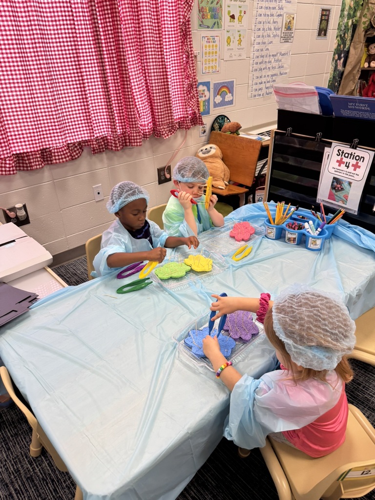 Mrs. Williams' Pre-K class explored community helpers this week through hands-on dress-up and medical play designed to strengthen their fine motor skills.