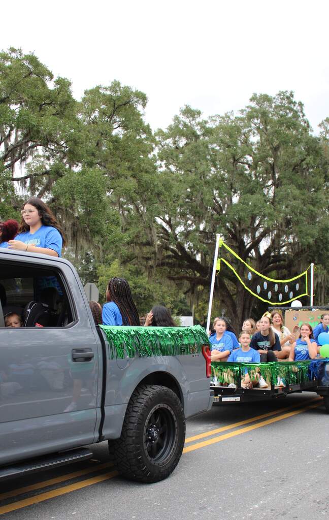 volleyball team on their homecoming float