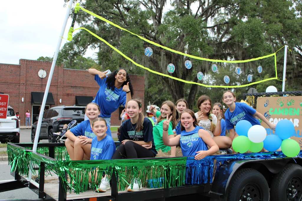 Volleyball team on their homecoming float