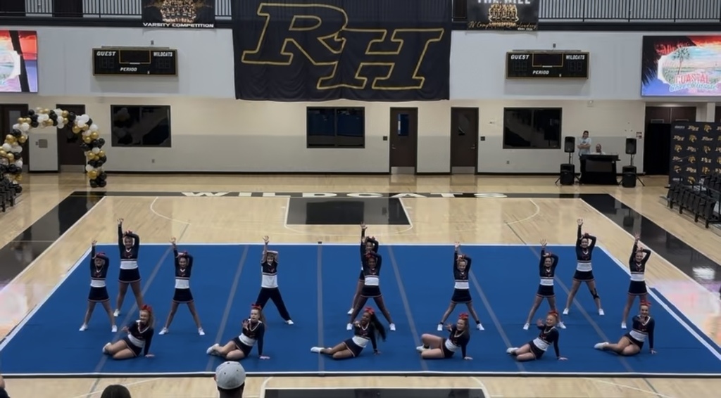 Cheerleaders on the math in formation.