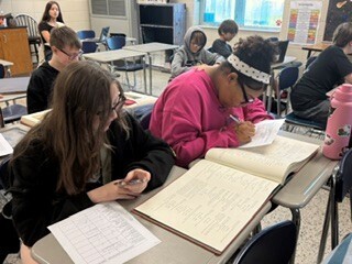 Bessette's Bird Club photo of 2 girls working on project.