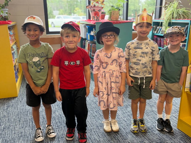 Group posing with hats