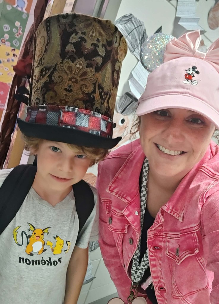 Group posing with hats