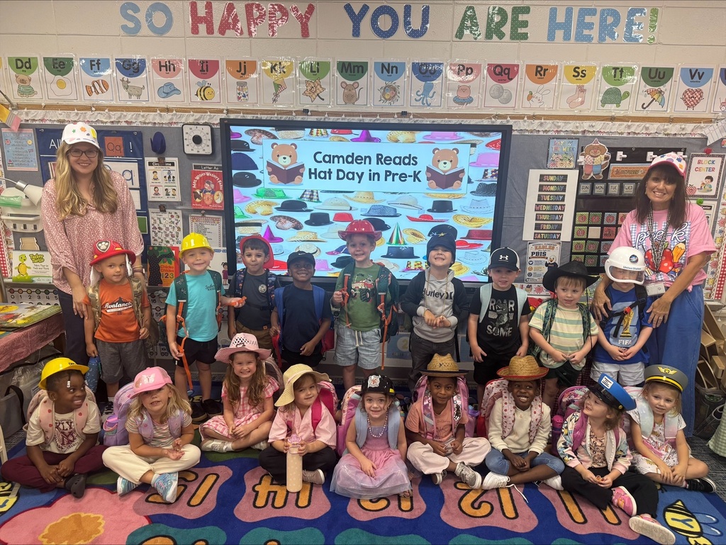 Group posing with hats