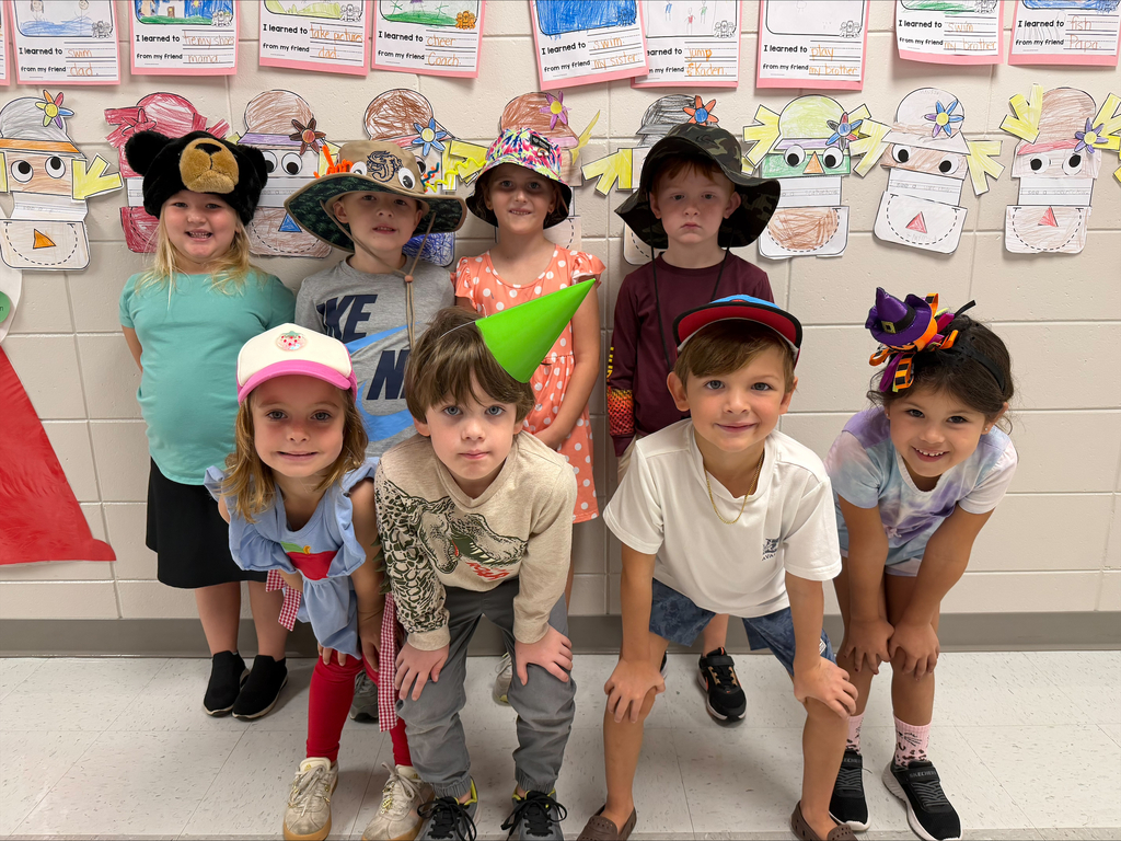 Group posing with hats