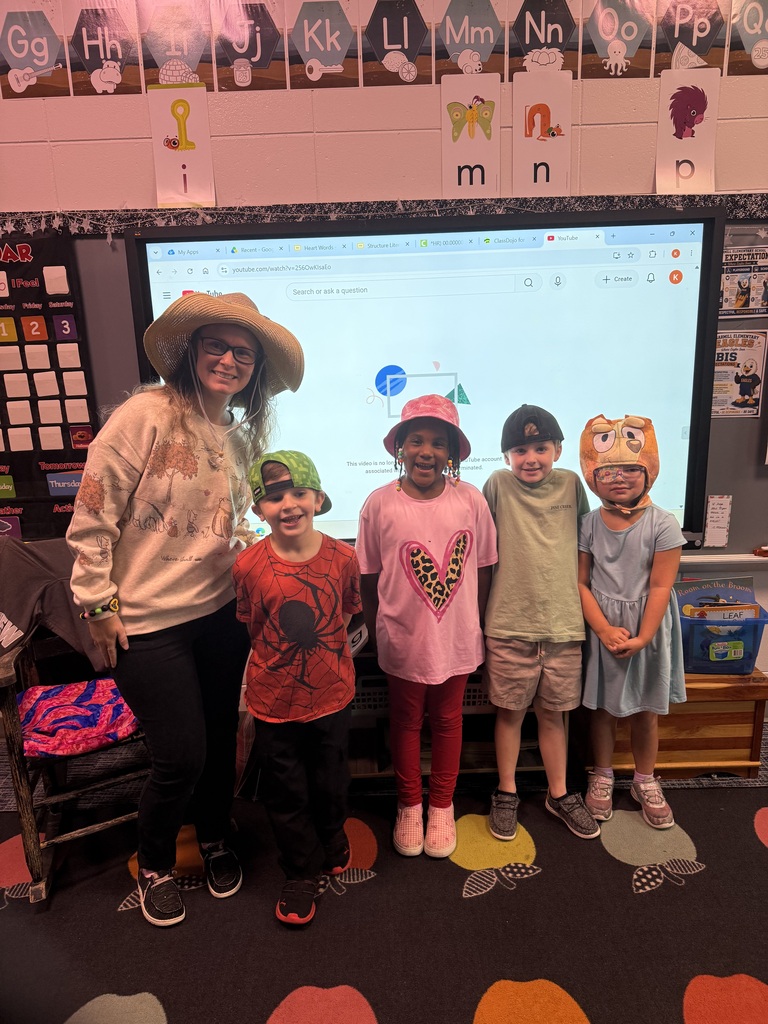 Group posing with hats