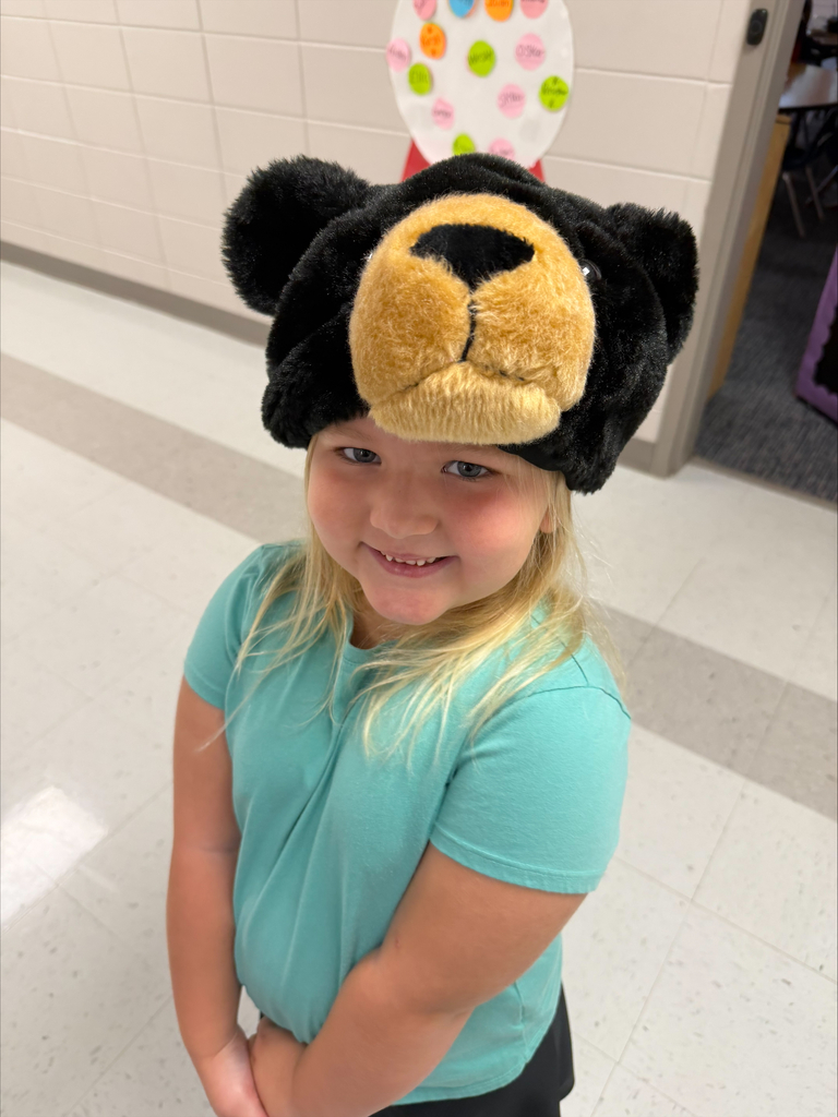 Student posing with hat