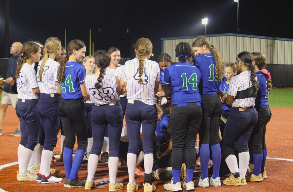 Camden Middle and St Marys middle softball players huddled