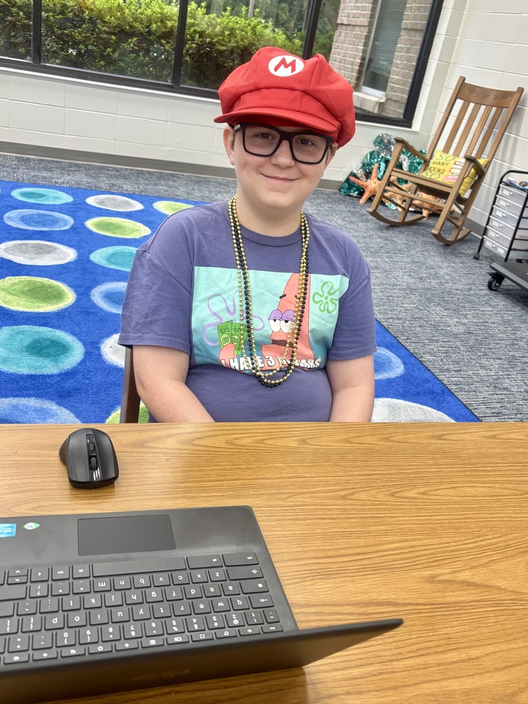 Wearing a red Mario hat from Mario's World.