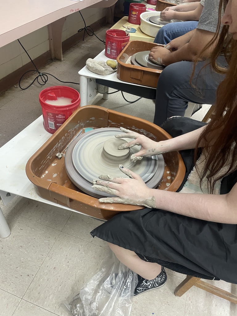ceramics 2 students throwing pottery