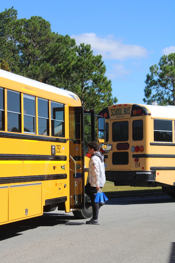 Student giving gift to bus driver