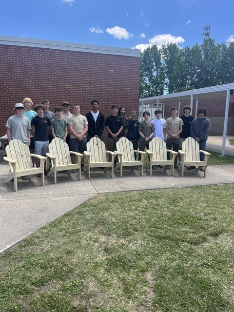 CCHS Students with wooden chairs that they built