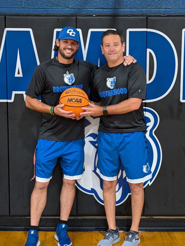 Coach Harnly officially passed the basketball to Ricky Krainiak, who was approved as the new Head Varsity Boys Basketball Coach