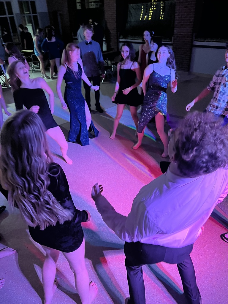 Students dancing in a circle at dance