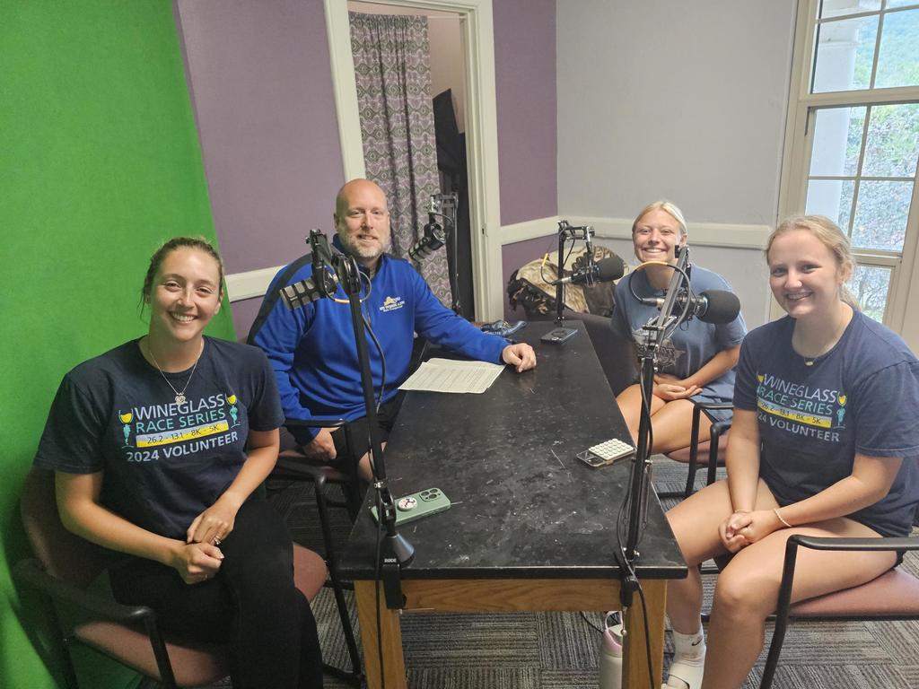 Group picture of podcast with two athletes and two adults
