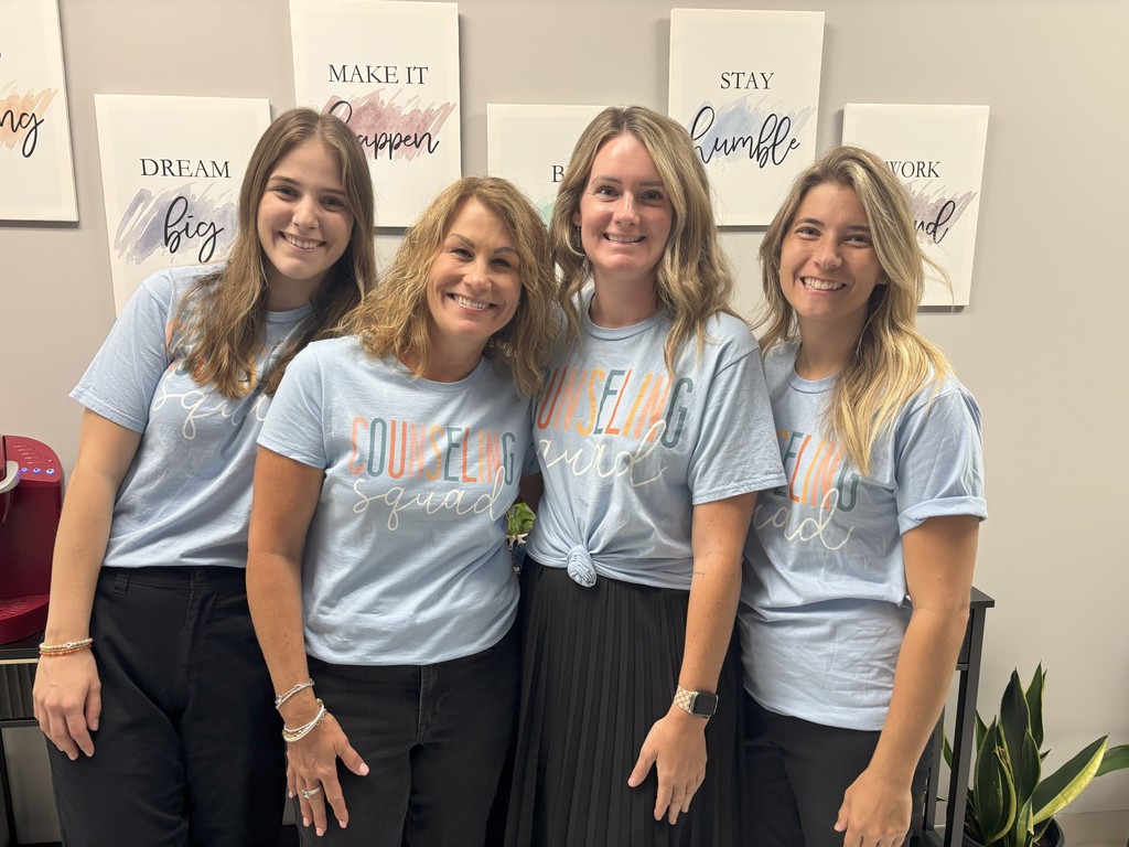 HS Counselors in blue counseling shirts posing together