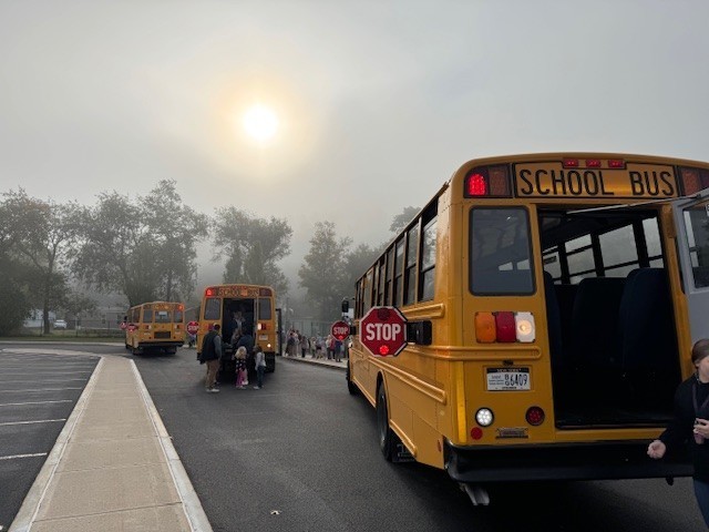 Bus drill picture, students getting off back of the bus