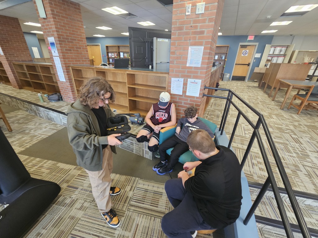 Students teaching each other how to fly drones