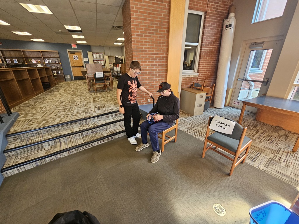 Students teaching each other how to fly drones