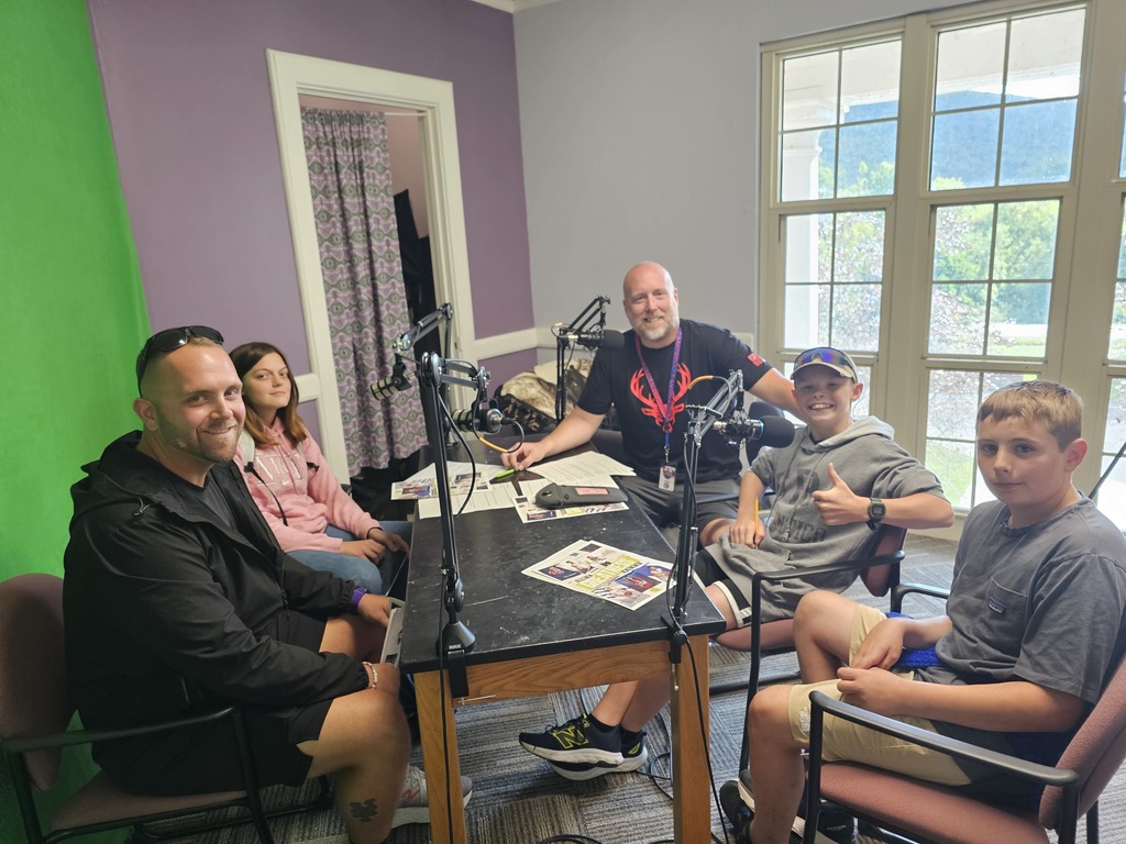 Picutre of podcast studio with cross country team