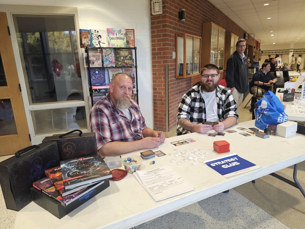 Strategy club picture of two advisors wearing flannel shirts