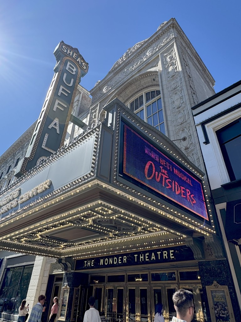 Picture of the outside of the the Wonder Theater with the Outsiders billboard